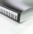 Segregator z motywem klawiatury fortepianu A4 zawiera 20 folijek